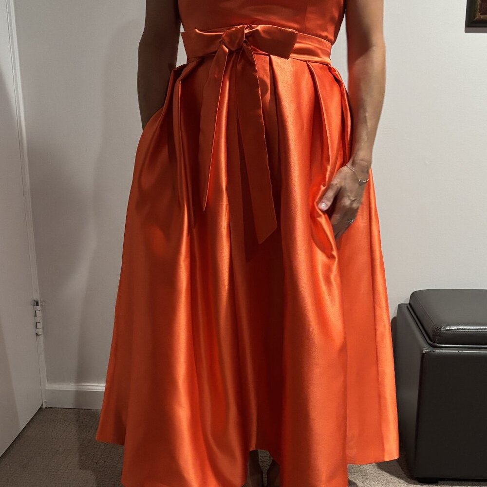 Classy, tea length dresses in tangerine